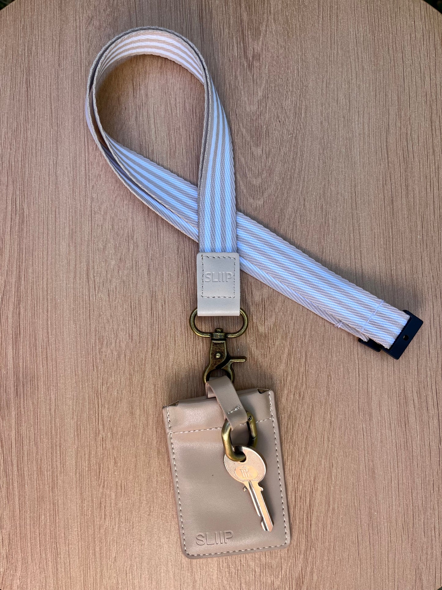beige key pouch with snap closure