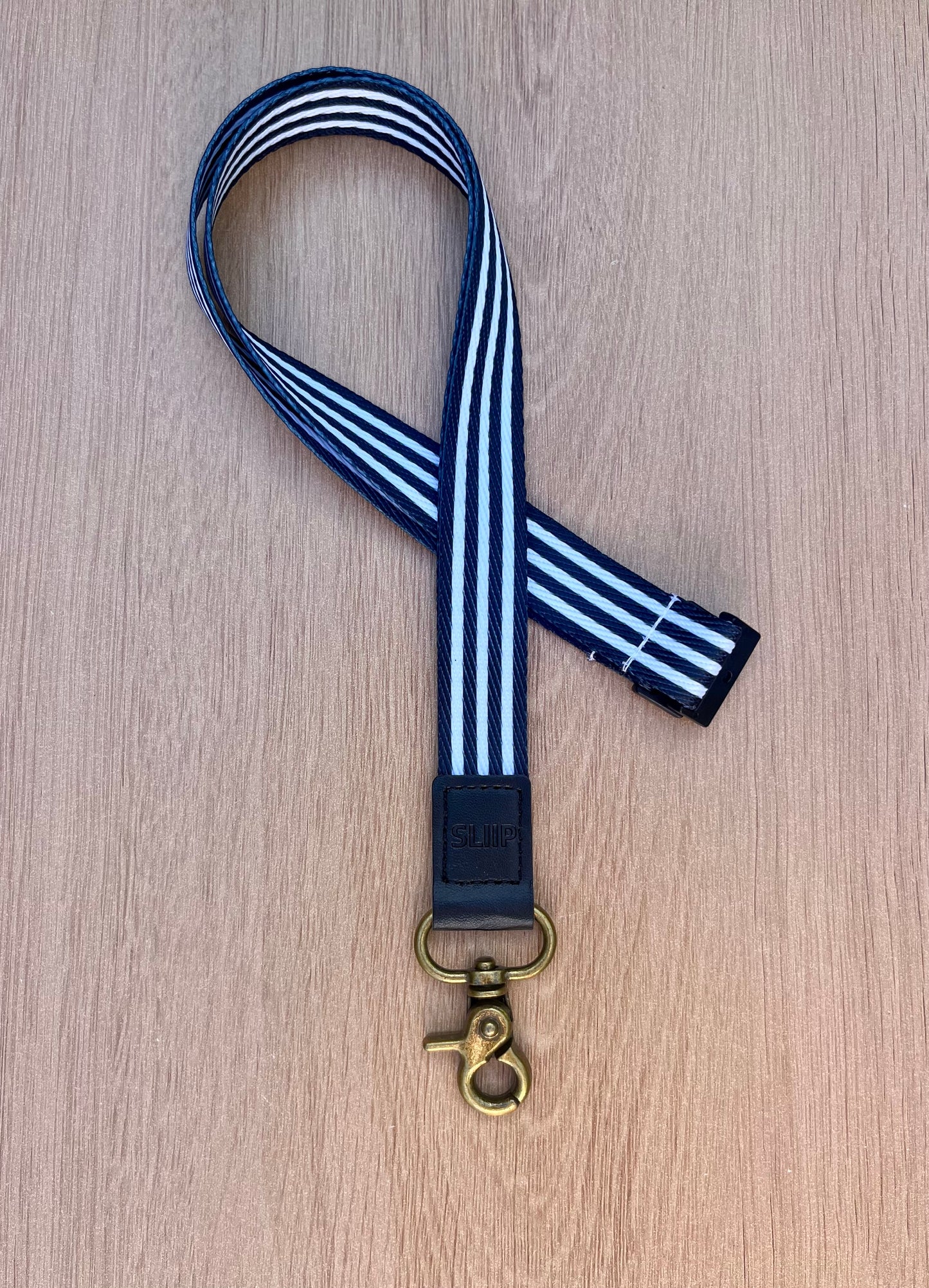 black and white striped lanyard, safety clip