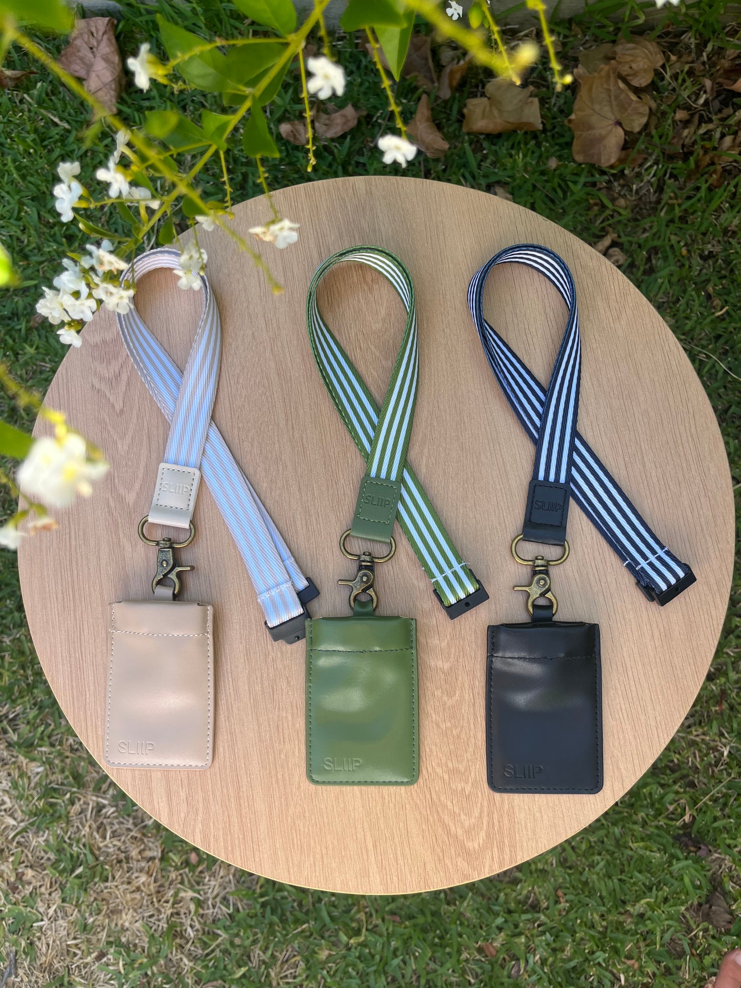 beige, green and black lanyard and keypouch set