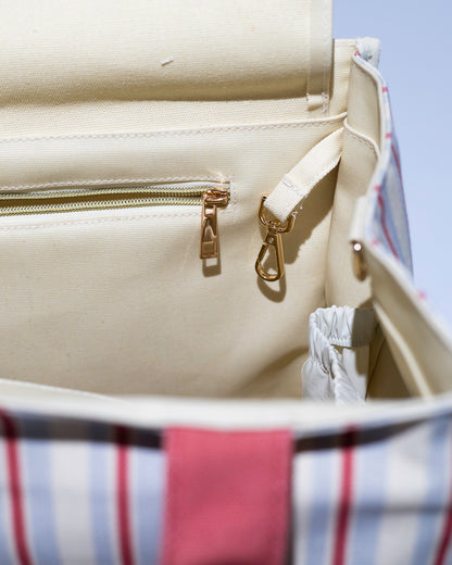 close-up of tote bag showing key attachment and gold hardware
