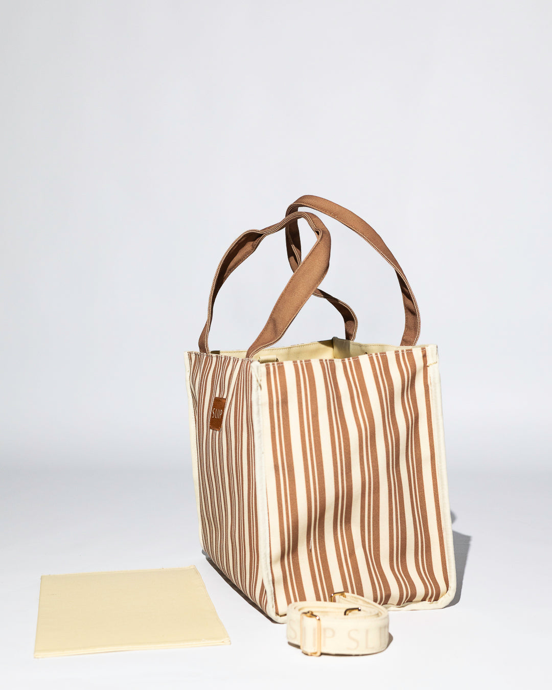 Structured tote bag brown and beige striped with brown handles , shoulder strap and base