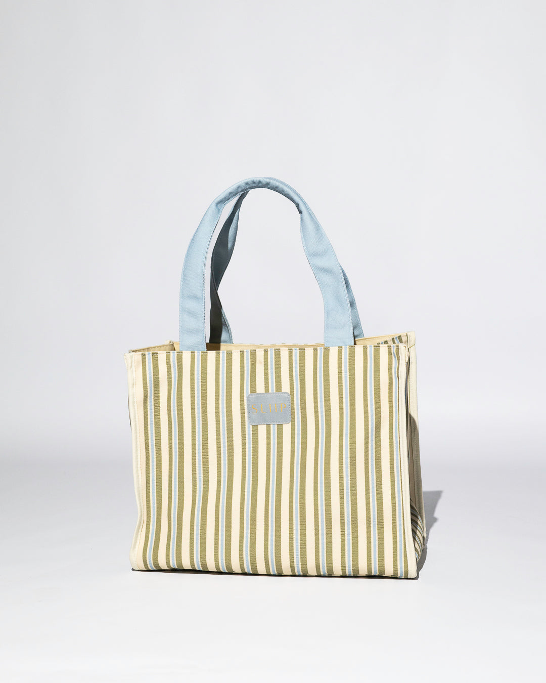 Striped blue, green and beige tote bag with a light blue handles